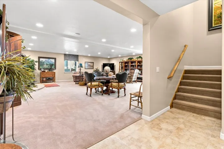 Spacious room with recessed lighting and carpeted flooring