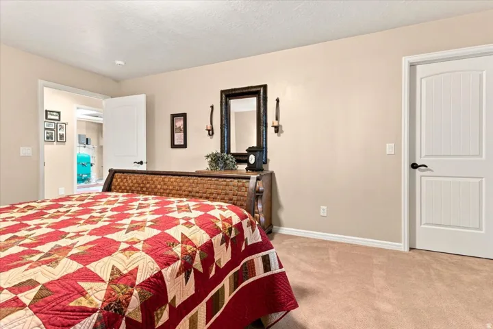 Neutral wall tones, carpeted flooring, and white trim