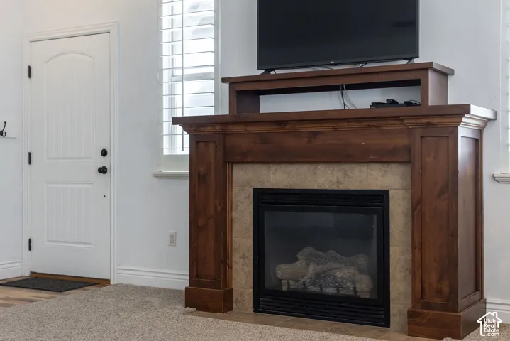 Gas fireplace with a wood-finish mantel