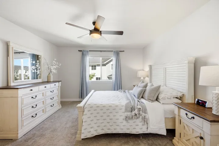 Neutral wall tones complement the neutral carpet flooring