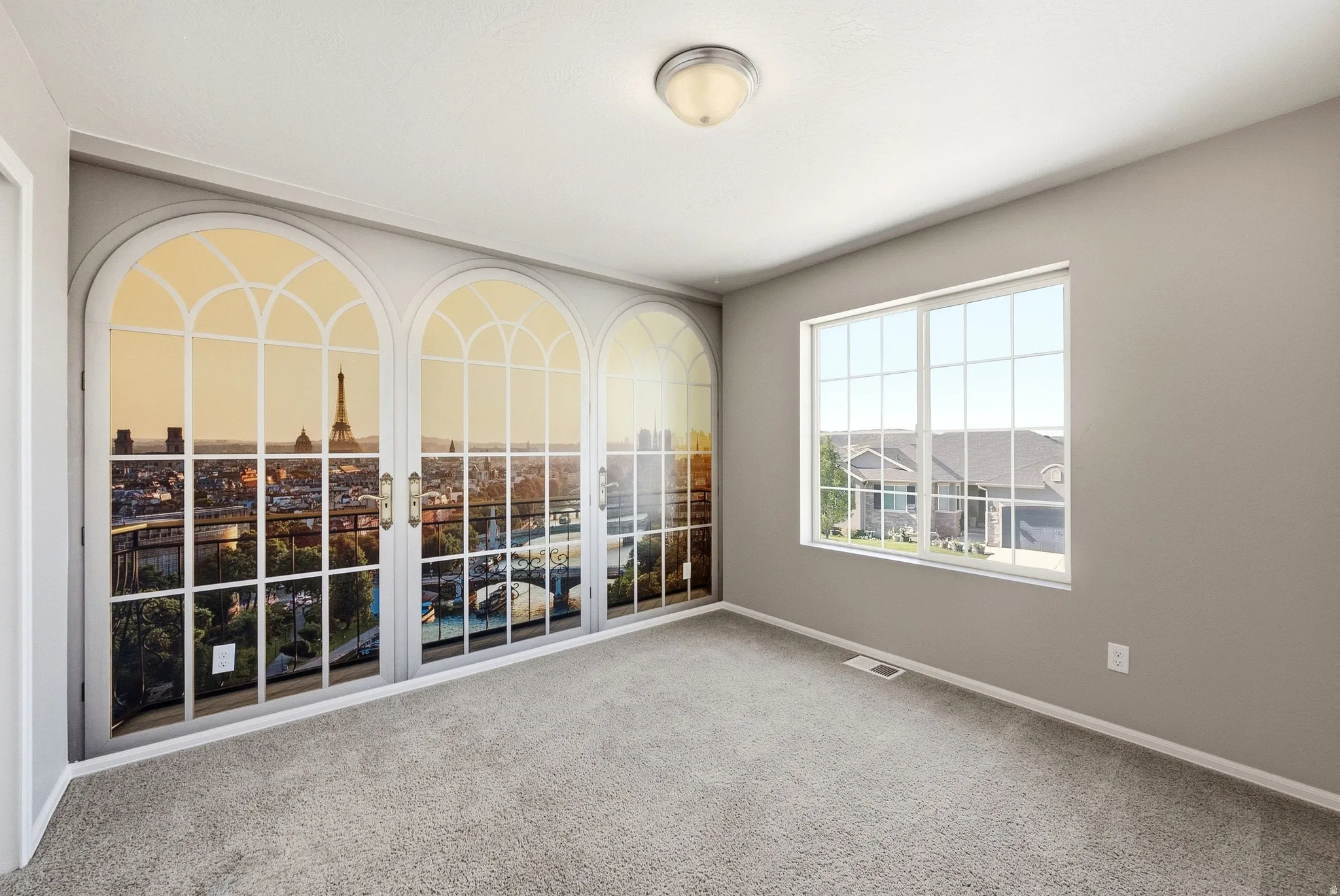 Recessed lighting and a flush mount fixture illuminate the room