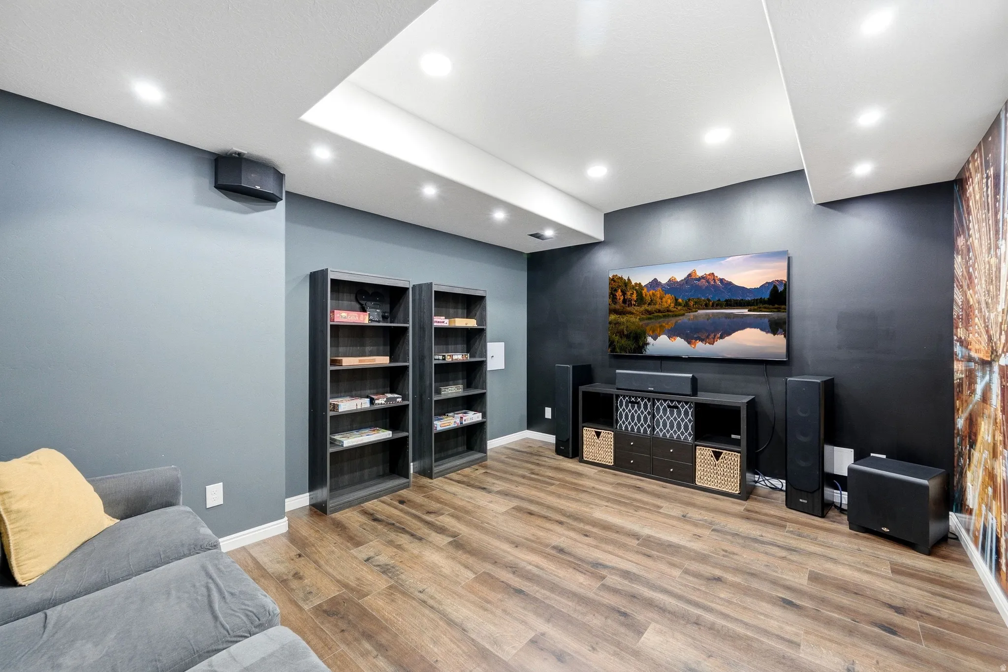 Recessed lighting, wood-finish flooring, and built-in shelving units