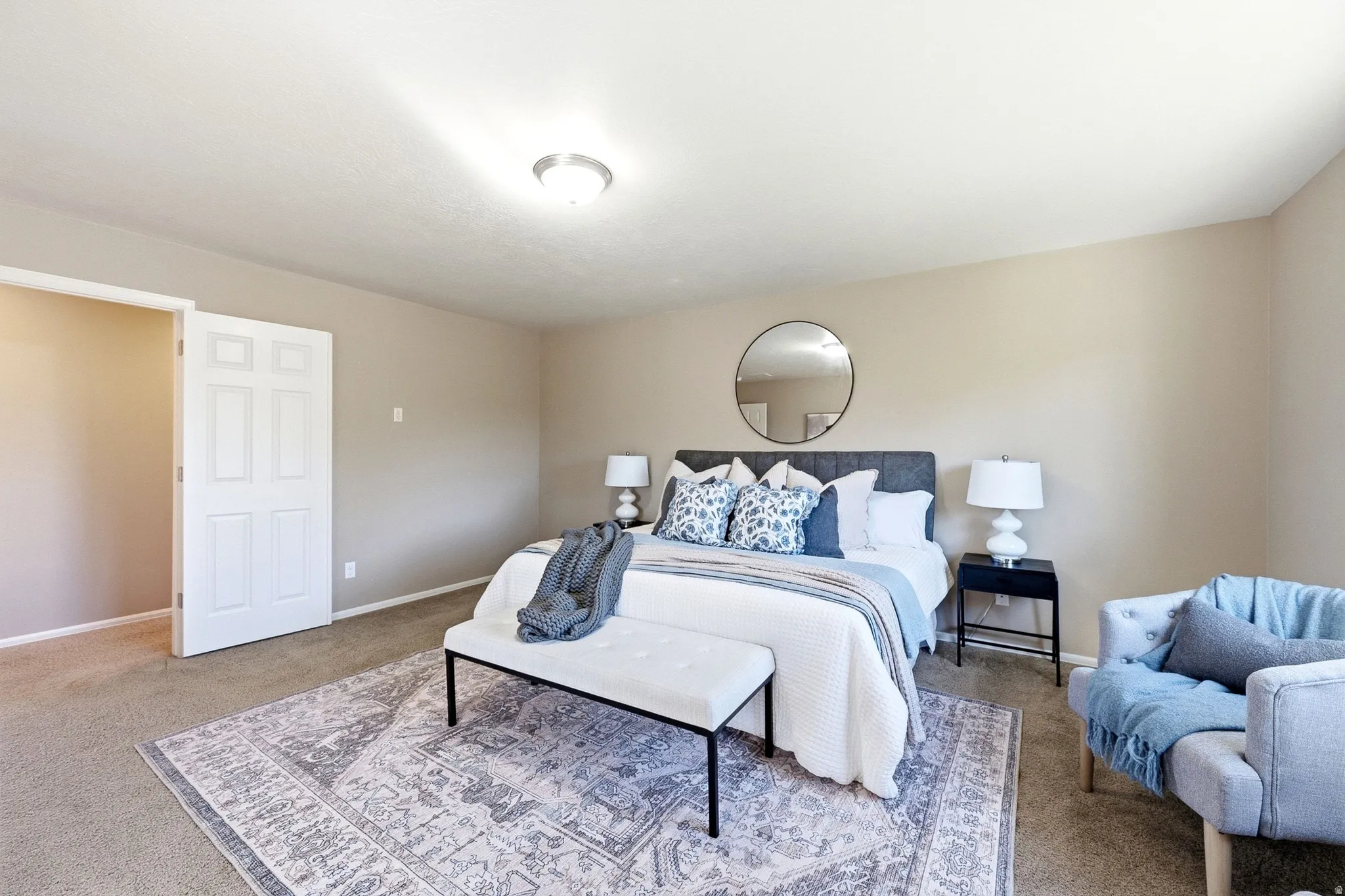 Recessed lighting, carpeted flooring, and a six-panel interior door