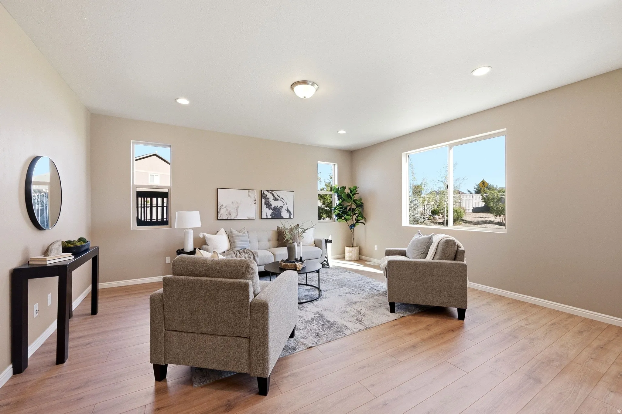 Spacious interior with neutral wall tones and wood-finish flooring