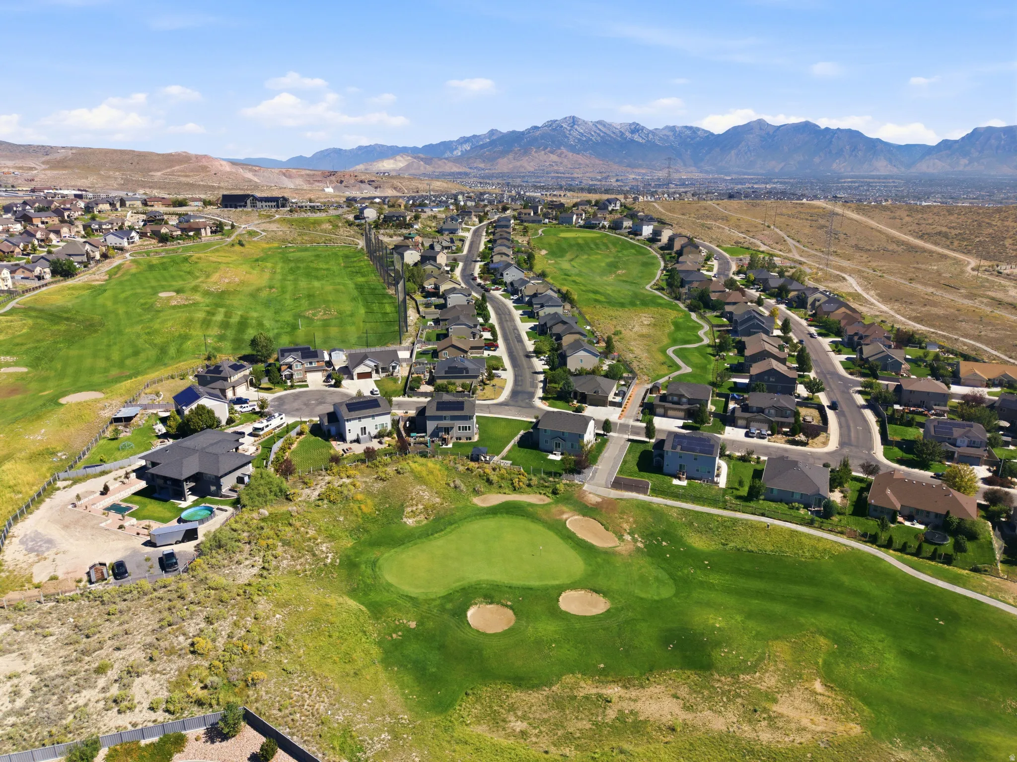 Golf course frontage with green and sand traps