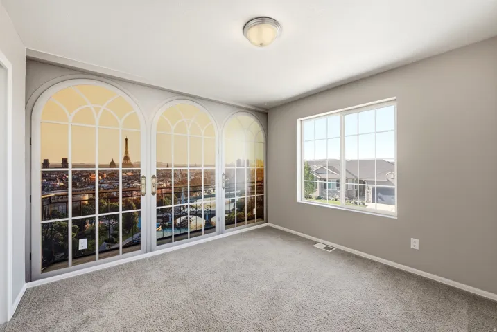 Recessed lighting and a flush mount fixture illuminate the room