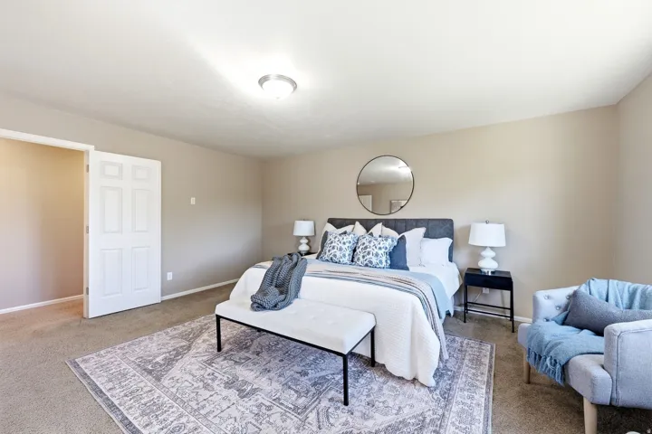 Recessed lighting, carpeted flooring, and a six-panel interior door