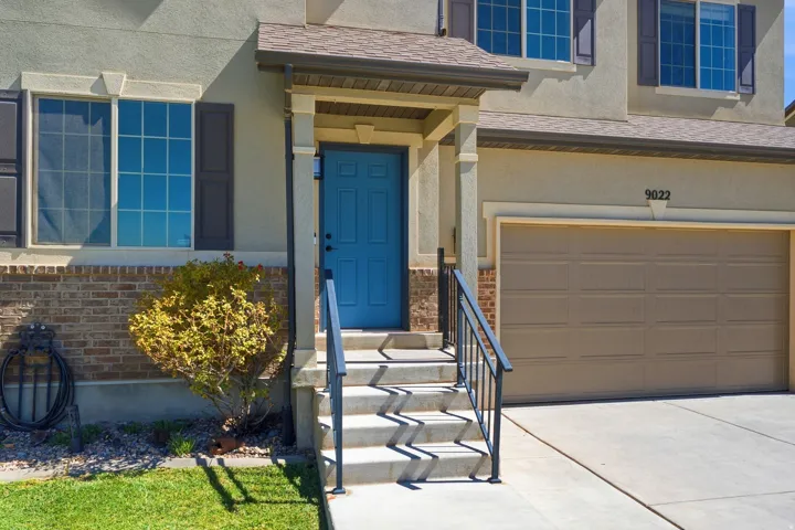Stucco exterior with brick detailing