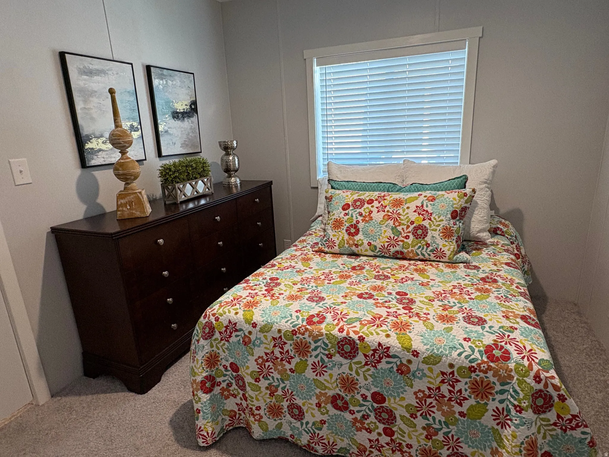Carpeted flooring, window with blinds, and white trim