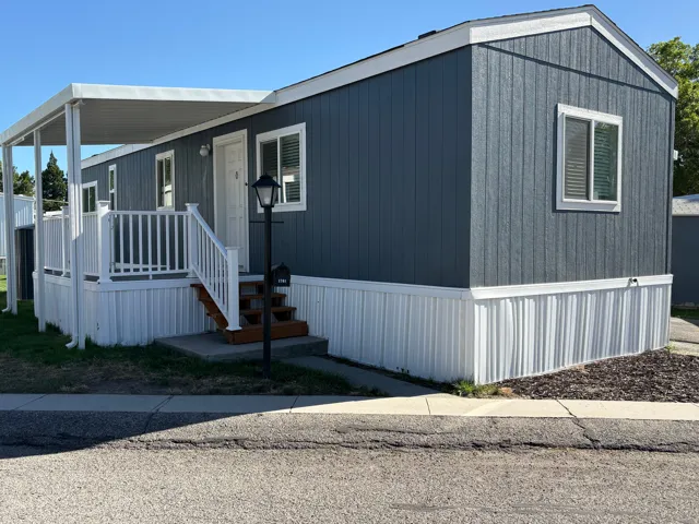Blue vertical siding exterior with white trim