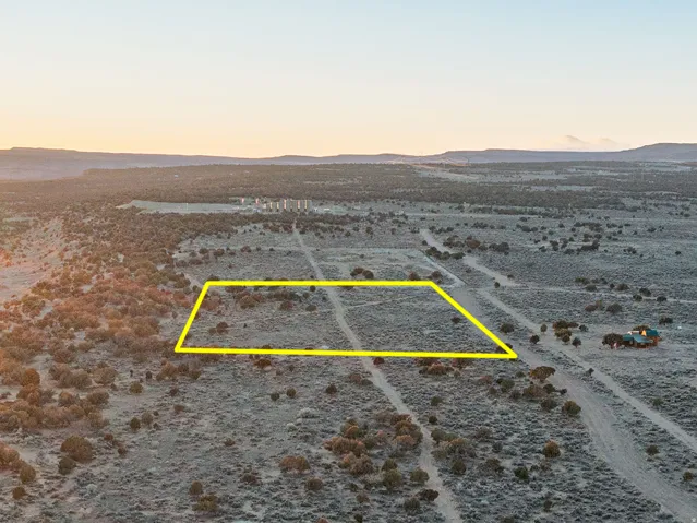 Expansive undeveloped land featuring natural terrain and distant mountains
