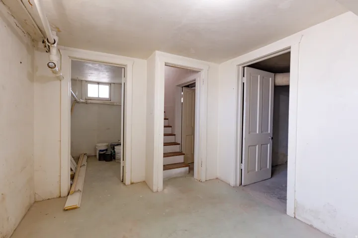 Concrete flooring with white painted walls
