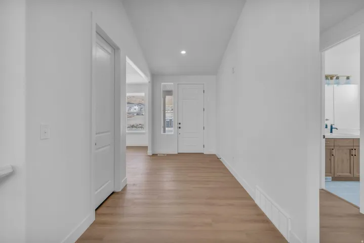 Large entry with 8' tall front entry door with a sidelight window.