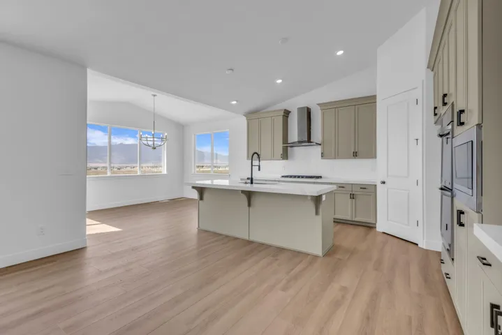 Spacious kitchen with view into huge dining room 15' wide, with incredible mountain views from windows on all three sides.