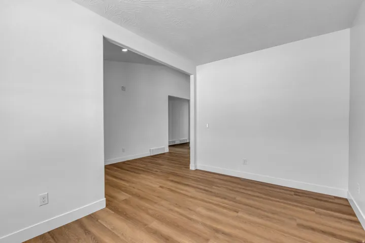 Spacious office or flex space off the entry with vaulted ceiling.