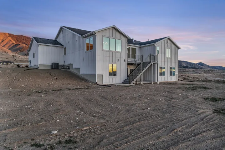 View from northwest corner of property showing deck and large yard ready for your dream backyard to come to reality.