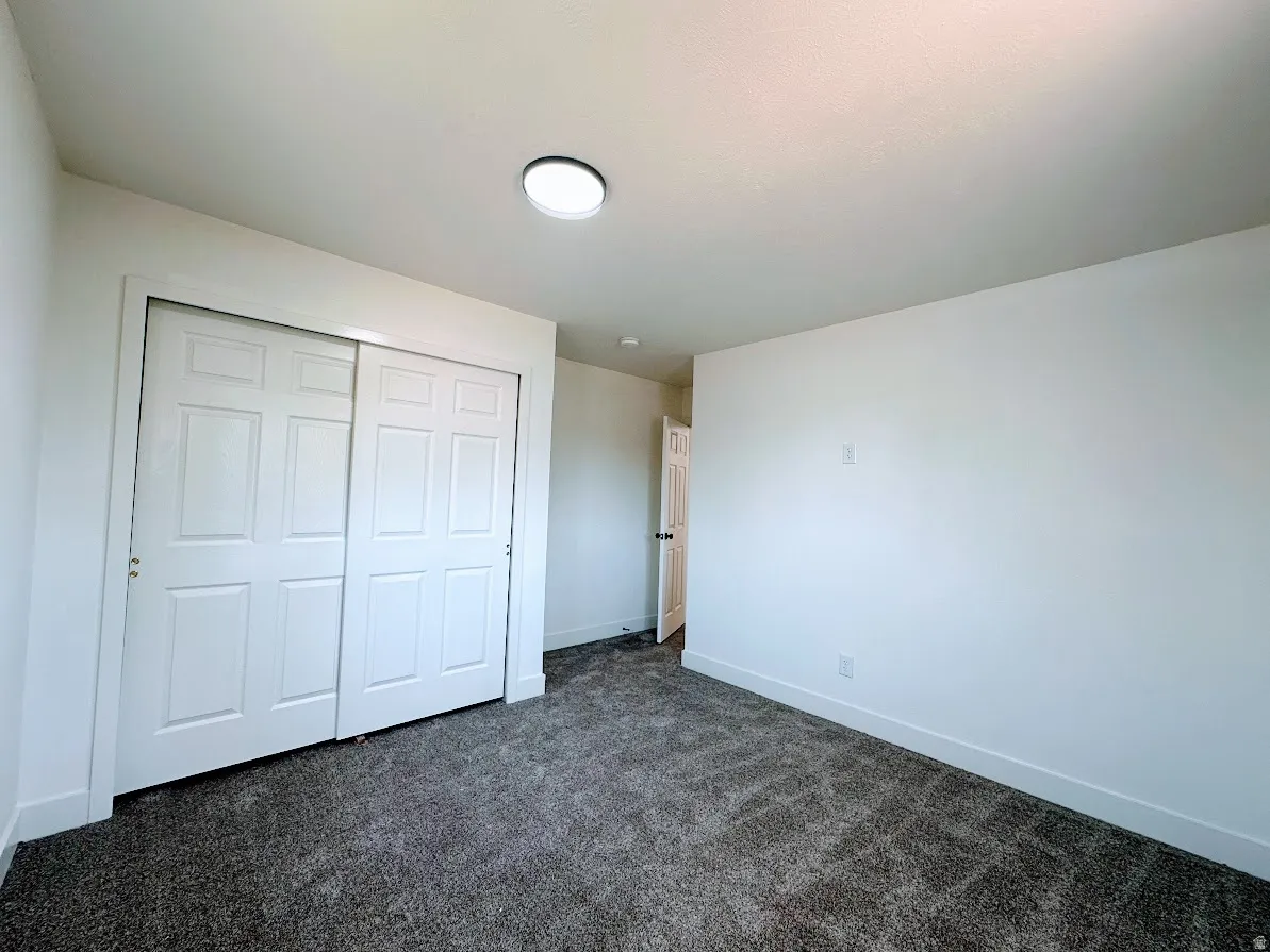 Neutral wall paint with textured carpet flooring