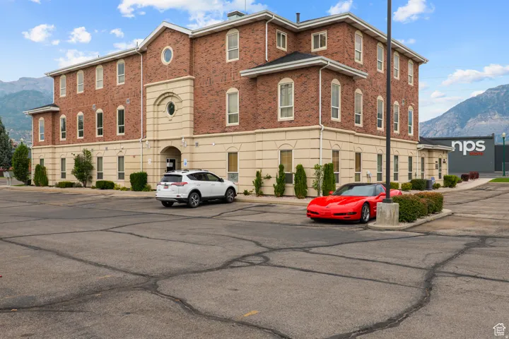 Brick facade building featuring multiple stories and a prominent entrance