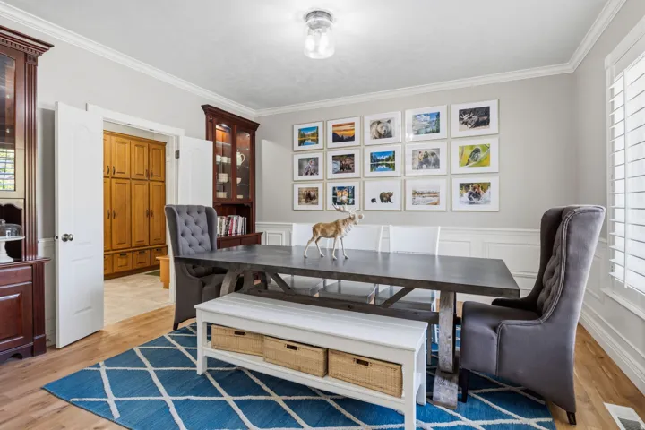 Hardwood-style flooring with light gray walls and white trim