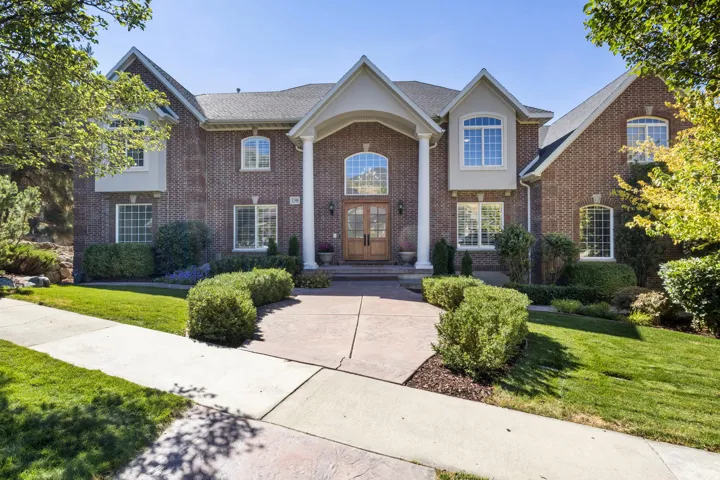 Brick exterior with multiple gables and arched window details