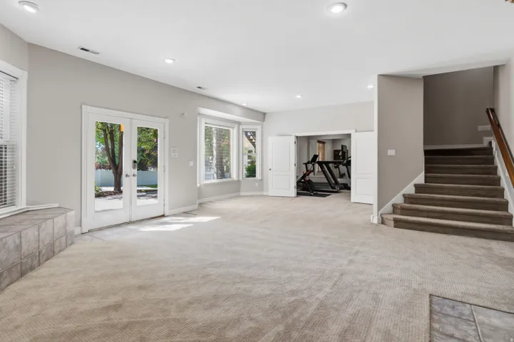 Expansive carpeted area with recessed lighting