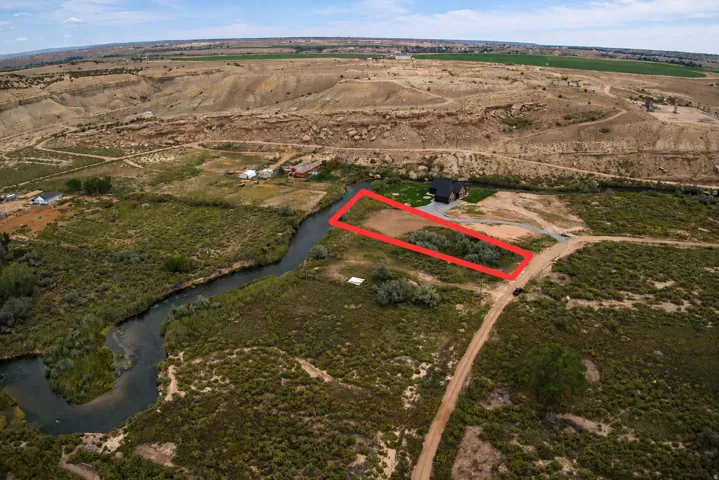 Riverfront property with level building pad and established trees