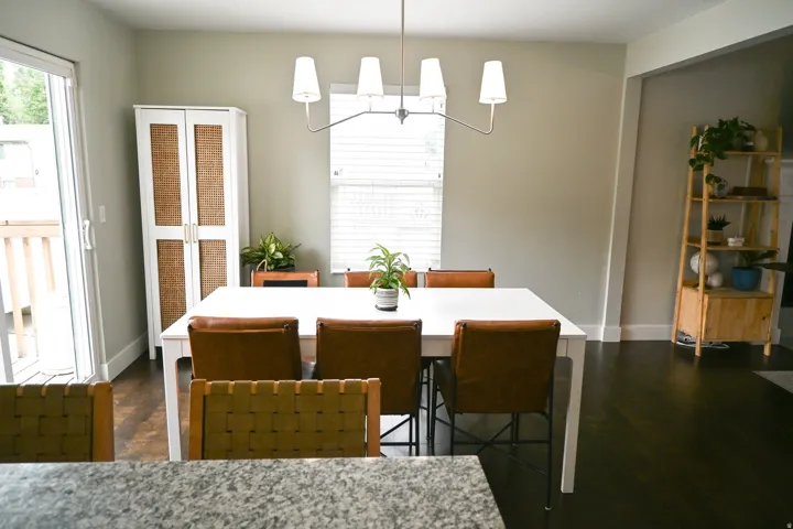 Dark wood-finish flooring, white trim, and a sliding glass door