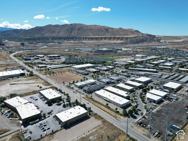Expansive commercial district featuring multiple buildings, paved roadways, and ample parking areas