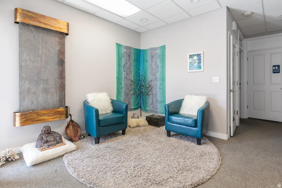 Wall-mounted waterfall feature with wood-finish accents