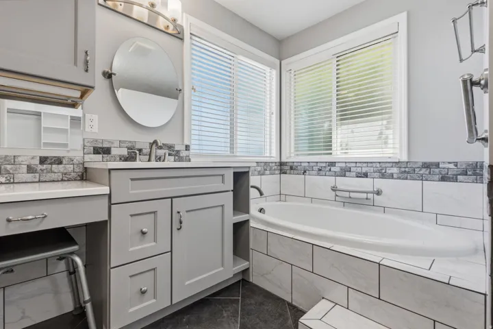 Built-in soaking tub with white tiled surround