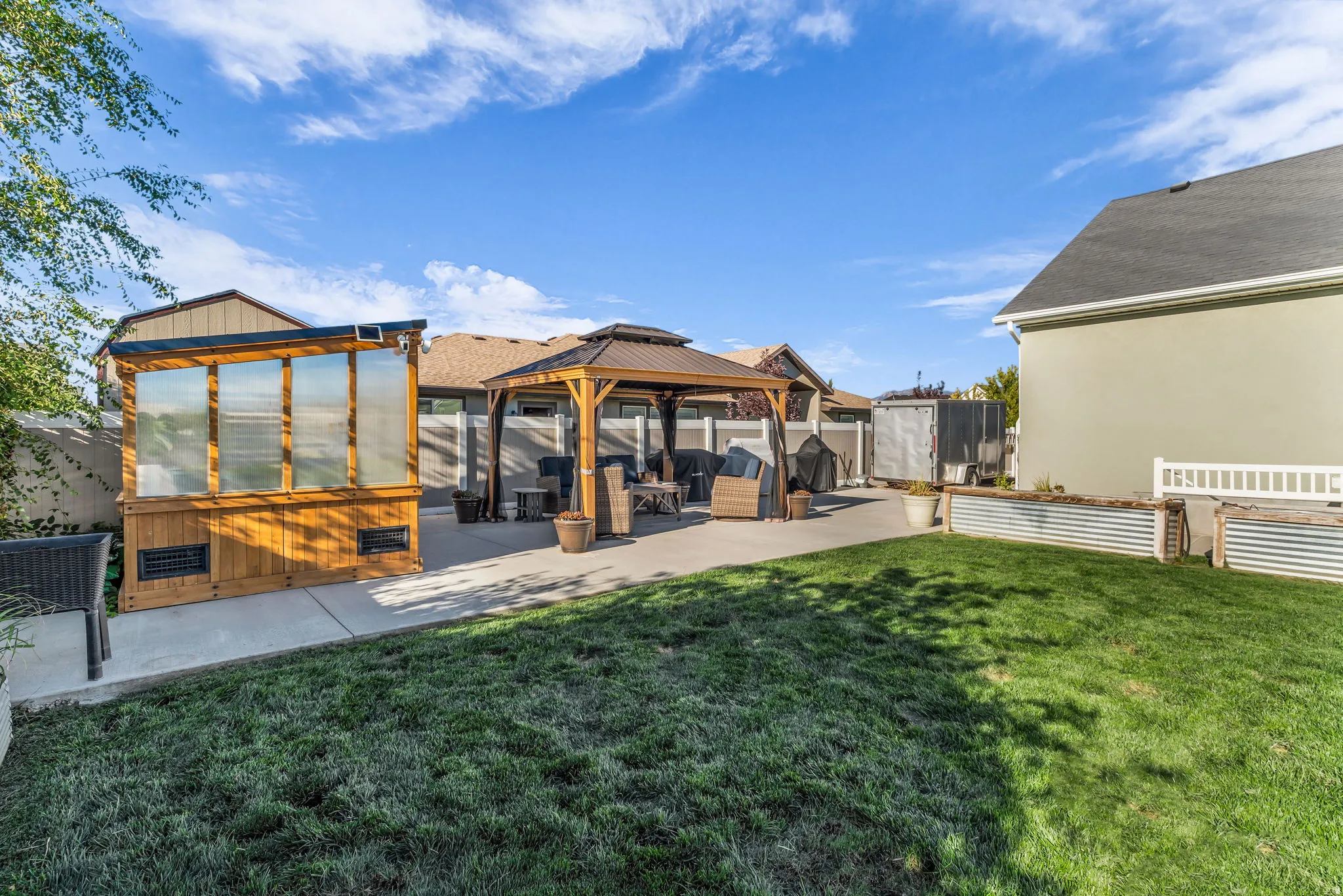 backyard with greenhouse/pergola