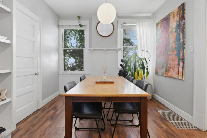 Wood-finish flooring with light gray walls and white trim