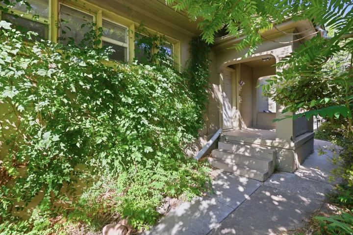 Covered entry porch with concrete steps