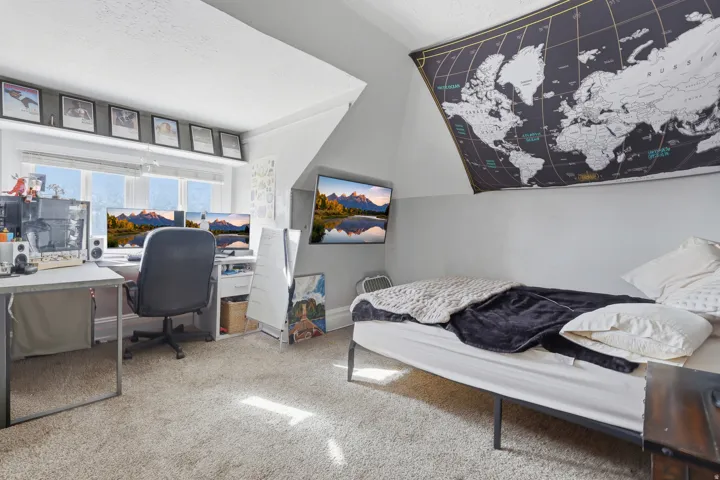 Wall-mounted television and window providing natural light