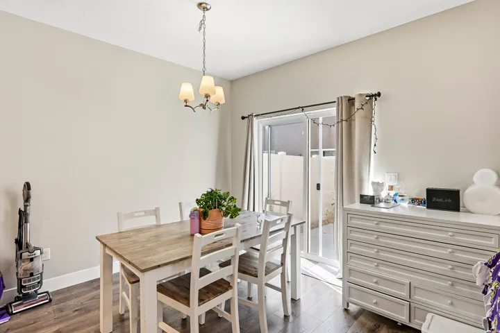 Recessed lighting, wood-finish flooring, and sliding glass doors
