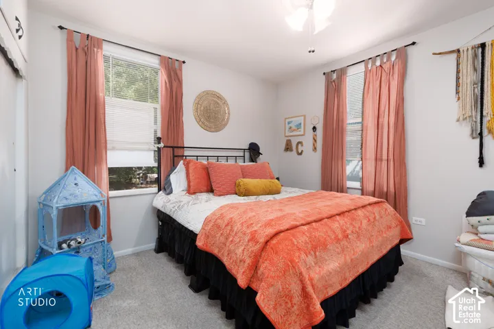 Carpeted flooring with light-colored walls