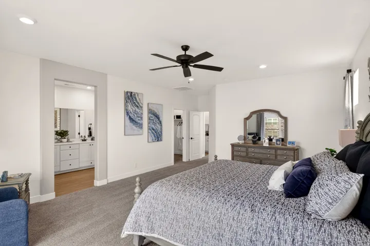 PHOTOS ARE OF A PREVIOUS MODEL HOME featuring the same floor plan and are provided for illustrative purposes only. Colors, finishes, fixtures, and selections may vary. Home will be delivered unfurnished.