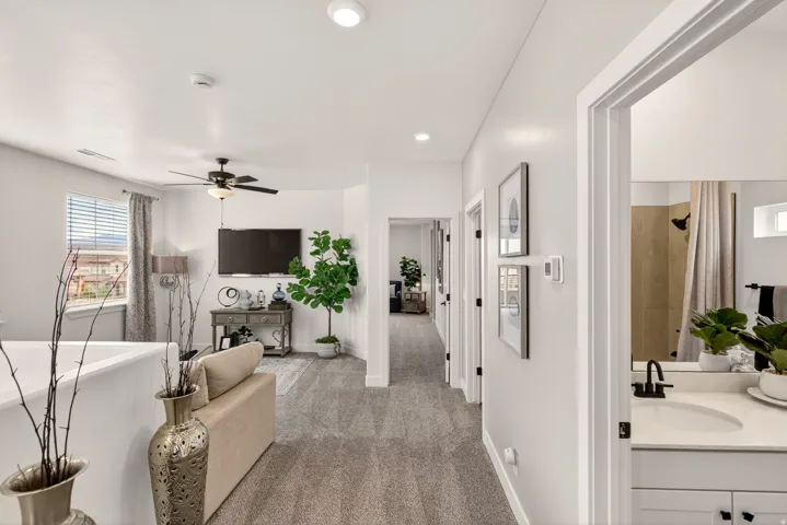 PHOTOS ARE OF A PREVIOUS MODEL HOME featuring the same floor plan and are provided for illustrative purposes only. Colors, finishes, fixtures, and selections may vary. Home will be delivered unfurnished.