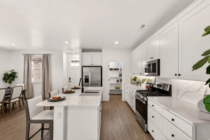 PHOTOS ARE OF A PREVIOUS MODEL HOME featuring the same floor plan and are provided for illustrative purposes only. Colors, finishes, fixtures, and selections may vary. Home will be delivered unfurnished.  Fridge Not included.
