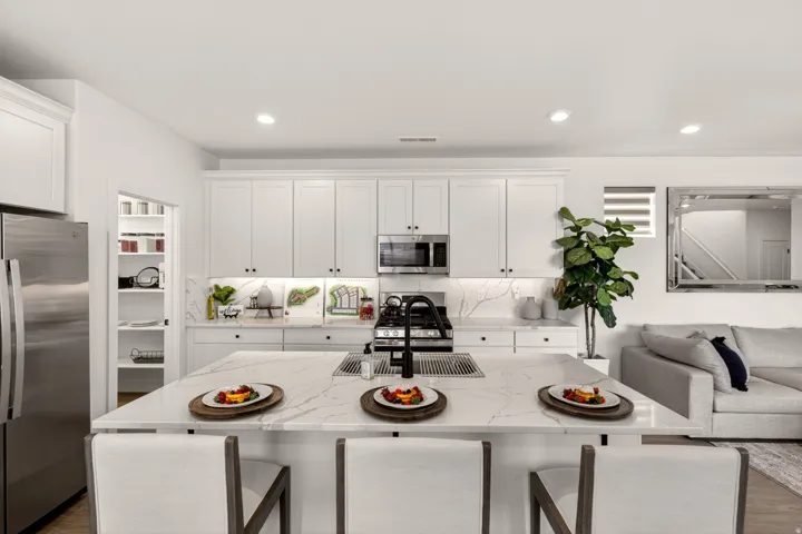 PHOTOS ARE OF A PREVIOUS MODEL HOME featuring the same floor plan and are provided for illustrative purposes only. Colors, finishes, fixtures, and selections may vary. Home will be delivered unfurnished.  Fridge Not included.