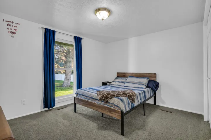 Carpeted flooring with white painted walls