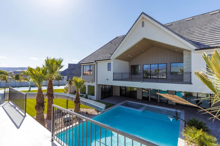 Contemporary exterior with a covered balcony and expansive sliding glass doors