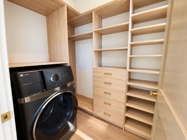 Built-in custom cabinetry with wood-finish shelving and drawers