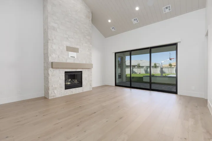 Vaulted ceiling with wood-finish planks, recessed lighting, and light wood-finish flooring