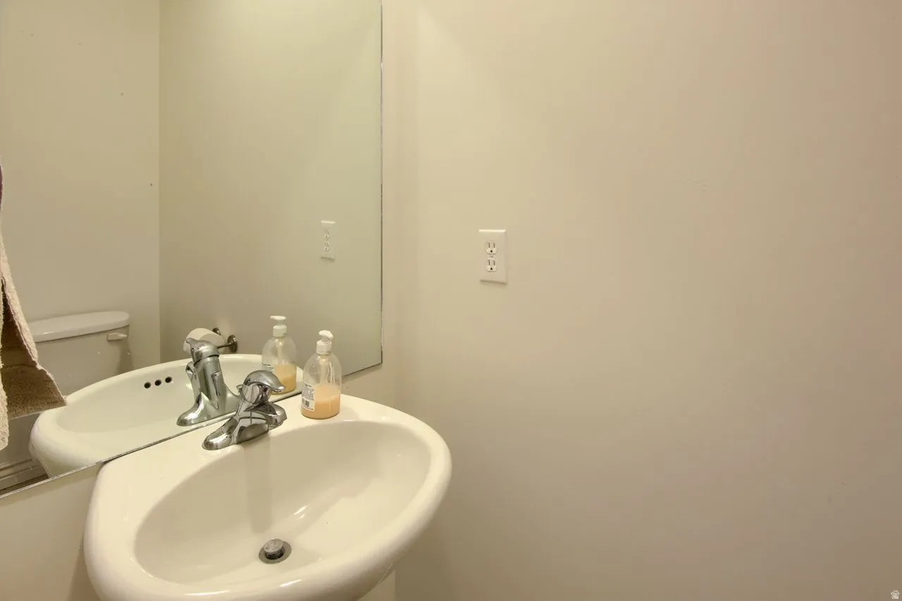 Pedestal sink with a chrome faucet