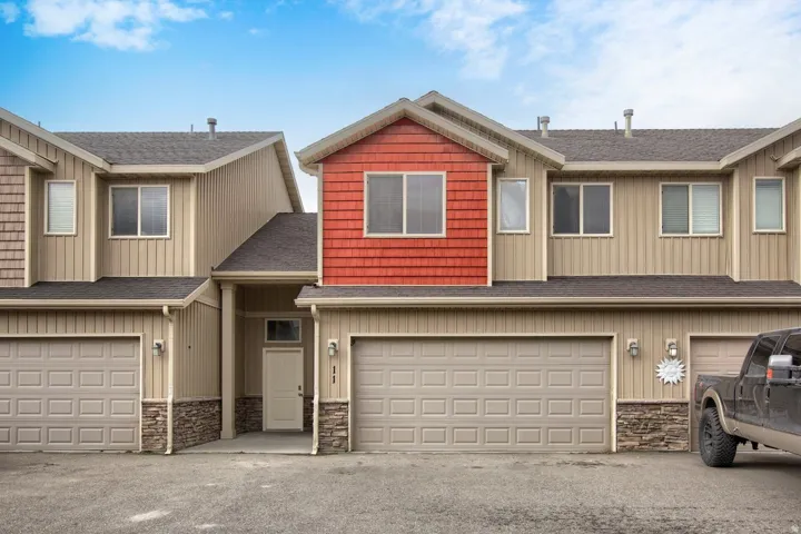 Multi-story exterior with vertical siding and shake accents