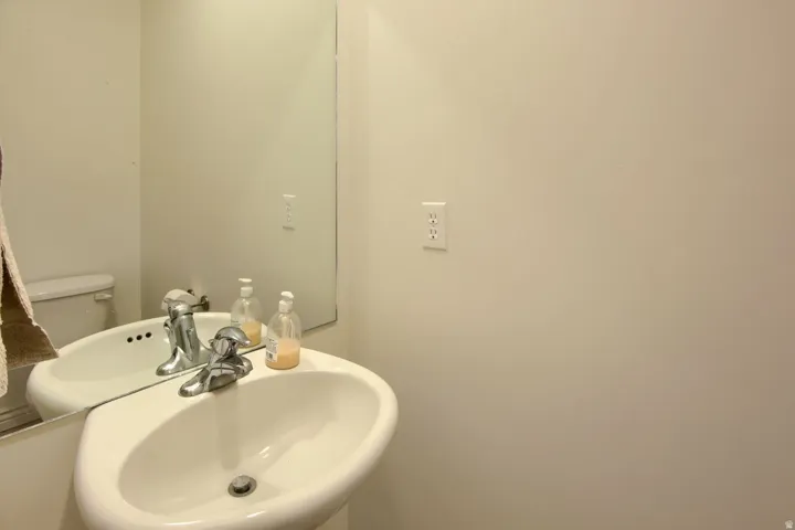Pedestal sink with a chrome faucet