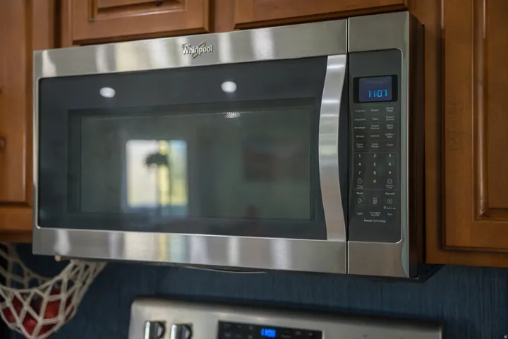 Stainless steel over-the-range microwave with integrated control panel