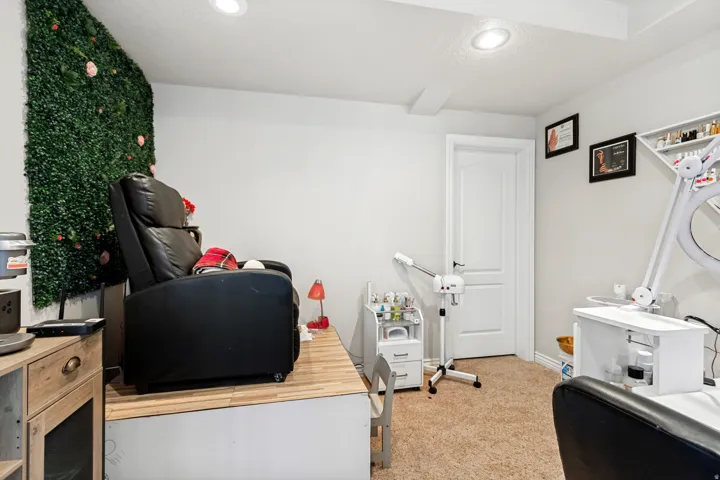 Recessed lighting and a paneled white door