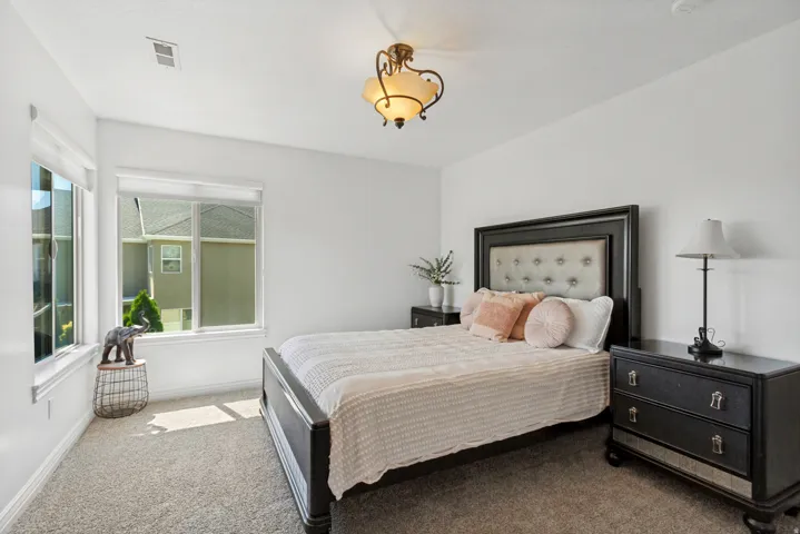 Recessed lighting, large windows, and wall-to-wall carpeting